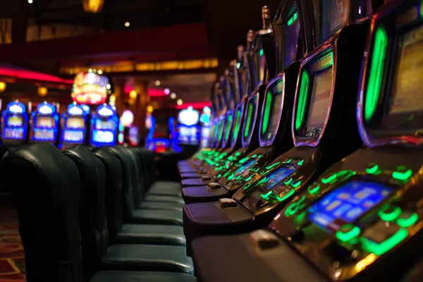 A woman in a luxurious green gown next to an ornate roulette wheel, capturing the upscale casino mood of PARIPULSE.