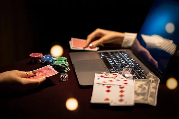 A player using their smartphone during a festive local event, representing PARIPULSE’s fully mobile-friendly casino.